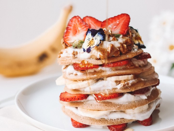 Banana pancakes with cashew butter and strawberries